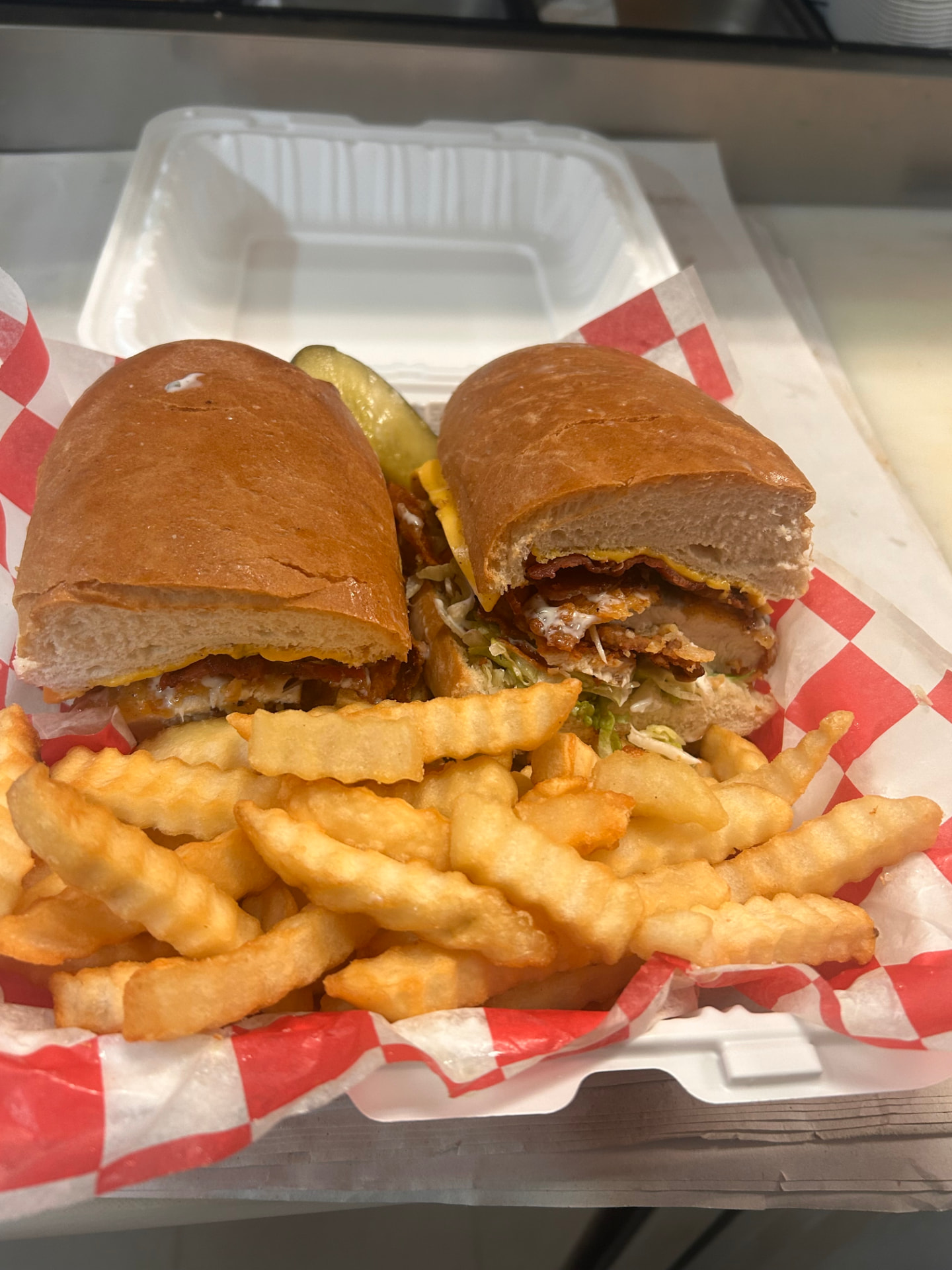 Crispy chicken bacon ranch sub with crinkle-cut fries